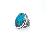 Royston Turquoise Ring Set in Sterling Silver with Flower Accents copyright chisholm trail designs 2025