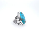 Royston Turquoise Ring Set in Sterling Silver with Flower Accents copyright chisholm trail designs 2025