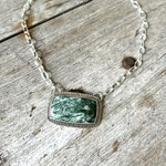 chisholmtraildesigns Argentium Silver Seraphinite Cabochon Necklace with inset Clear Faceted Zircon